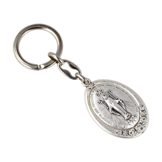 Keychain Miraculous Medal Oval Silver With Flowers. Souvenirs from Italy